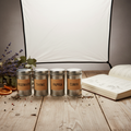 Harvest Reserve Seasonal Spice Collection with four kraft-labeled tins and an open recipe journal on weathered wood